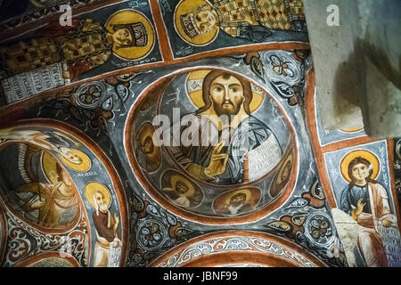 Colourful ceiling frescoes, religious wall paintings in interior of early Christian troglodyte rock church, Goreme, Cappadocia, Turkey Stock Photo