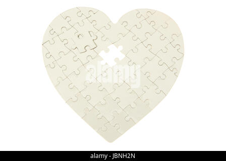 heart made from the puzzle on white Stock Photo