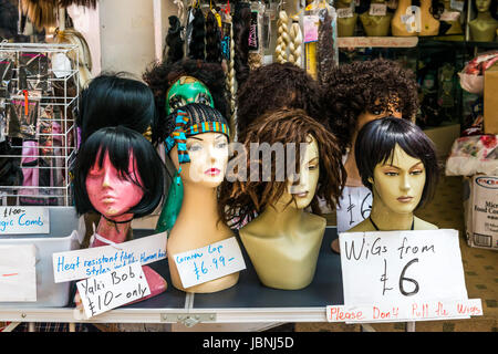London, United Kingdom - June 10, 2017: Brixton Market - Colorful and multicultural community market run by local traders in South London. Wigs shop Stock Photo