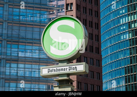 Berlin, Germany - june 9, 2017: The Undergrond metro / S-Bahn train station sign / S-Bahn Symbol of the Potsdamer Platz with its famous three office b Stock Photo