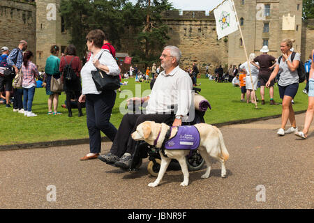Mobility scooter - Electric mobility scooter being ridden by an Stock