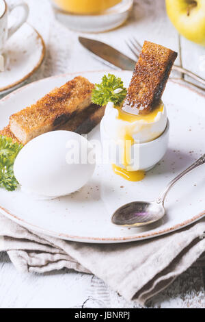 boiled eggs and crispy toasts Stock Photo