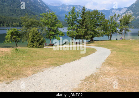 Bohinj, Slovenia - June 4, 2017: Tourists on a small boat in lake Bohinj, a famous destination not far from lake Bled. Stock Photo