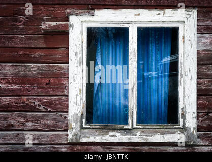 Old and abandoned house with wooden wall and window Stock Photo