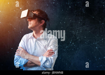 Businessman with VR goggles headset exploring virtual reality immersive technology content Stock Photo