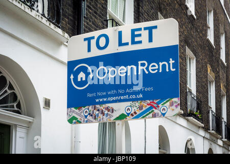 Open Rent To Let sign outside traditional London terraced housing, London, UK Stock Photo