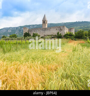 Church of the Holy Trinity, which contains famos late-medieval Danse Macabre fresco. Slovenia, Europe. Stock Photo