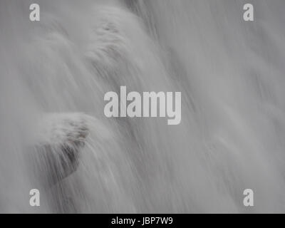 Close view at water splasing from the dam at Pen-y-garreg in one the reservoirs in the Elan Valley in Wales, UK Stock Photo