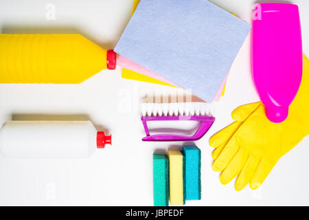 Range of cleaning products for the kitchen and bath. Detergents, chemical bottles, cleaning sponges and gloves. Stock Photo