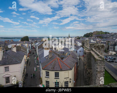 CAERNARFON, WALES - 29 SEPTEMBER 2013: View on the town of Caernarfon from the 13th century castle, well-known for its polygonal towers.  In 1969 Prince Charles was invested here as Prince of Wales by HM Queen Elizabeth II. Stock Photo