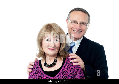 Loving senior couple posing over white background Stock Photo