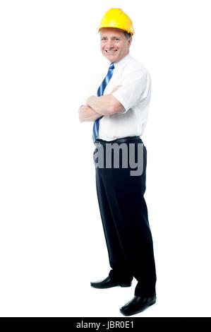 Smiling senior architect posing with ams crossed Stock Photo