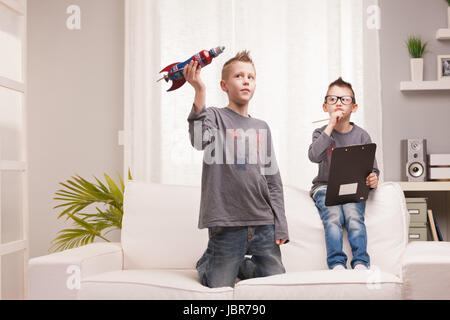 two boys playng as scientists and rocket inventors Stock Photo