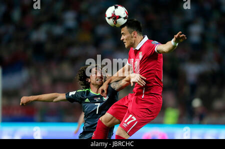 Belgrade. 11th June, 2017. Serbia's Filip Kostic (R) vies with Wales's Joe Allen during group D 2018 World Cup qualifying football match between Serbia and Wales in Belgrade, Serbia on June 11, 2017. The match ended with a draw 1-1. Credit: Predrag Milosavljevic/Xinhua/Alamy Live News Stock Photo