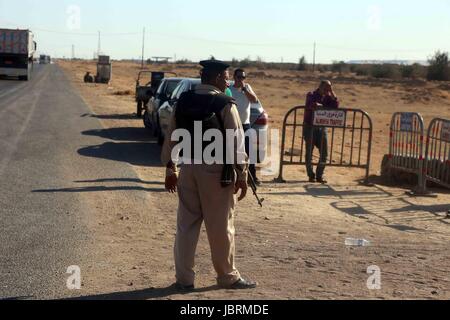 Al-Minja, Egypt. 26th May, 2017. A Egyptian soldiers guards a checkpoint near Al-Minja, Egypt, 26 May 2017, At least 26 Coptic Christians travelling in a bus to a cloister were killed when unknown assailants opened fire. Another 25 passengers were injured, according to the health ministry spokesman in Cairo. The motive of the attackers remains unknown at this point. Photo: -/dpa/Alamy Live News Stock Photo