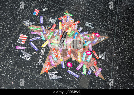 Hollywood, California, USA. 11th June, 2017.  Donald Trump's star on the Hollywood Walk of Fame was vandalized again during the LA Pride #ResistMarch and covered with stickers on June 11th, 2017.  Credit: Sheri Determan/Alamy Live News Stock Photo