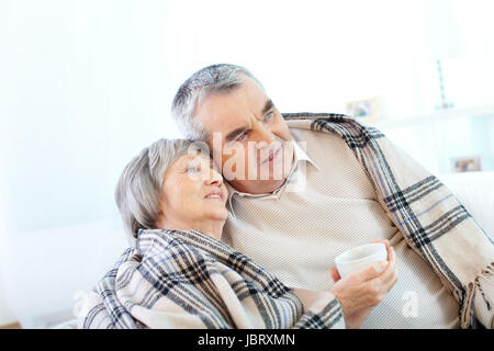 Image of couple of pensioners having tea at home Stock Photo