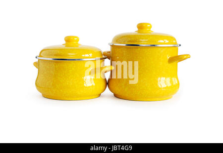 Two new yellow saucepans on white background. Clipping path is included Stock Photo