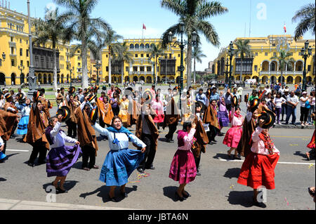 LIMA PERU MARCH 1: Indians in traditional peruvian dresses dancing in the square Plaza de Armas during the celebration of national independence in the Historic Center on march 1 2011 in Lima, Peru Stock Photo