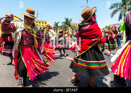 LIMA PERU MARCH 1: Indians in traditional peruvian dresses dancing in the square Plaza de Armas during the celebration of national independence on march 1 2011 in Lima, Peru.  Plaza de Armas Is the birthplace of the city of Lima, as well as the core of the city. Located in the Historic Centre of Lima. Stock Photo