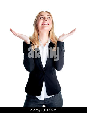 Happy excited business woman with raised hands and looking up waiting for inspiration, isolated on white background, good job concept Stock Photo