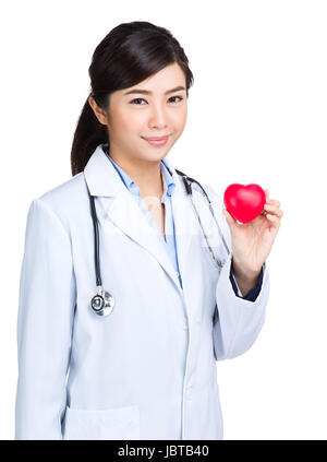 Doctor hold heart shape ball Stock Photo