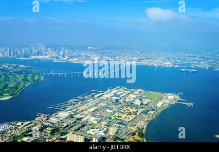 Aerial view of the Coronado island and bridge in the San Diego Bay in Southern California, United States of America. A view of the Skyline of the city and some boats crossing the the sea. Stock Photo