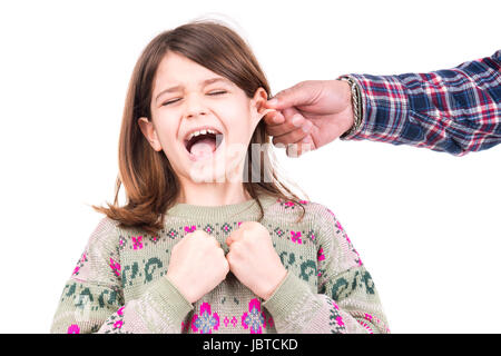 Young girl being punished with ear pulling Stock Photo