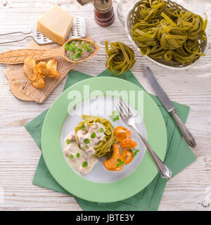 ,,tagliatelle con Spinaci,, with chanterelles Stock Photo