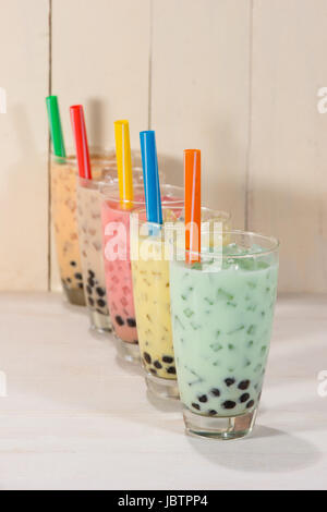 https://l450v.alamy.com/450v/jbtpp4/boba-bubble-tea-homemade-various-milk-tea-with-pearls-on-wooden-table-jbtpp4.jpg