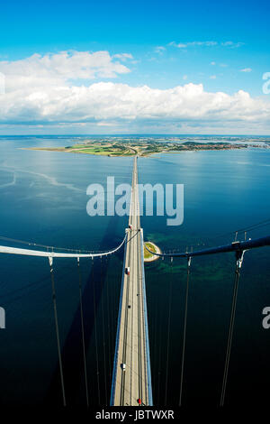 Denmark, September 9, 2013. The Great Belt Bridge consists of a suspension bridge, a railway tunnel and a box girder bridge running between the Danish islands Zealand and Funun. The bridge alo passes the small island Sprogø in the middle of the Great Belt. Stock Photo