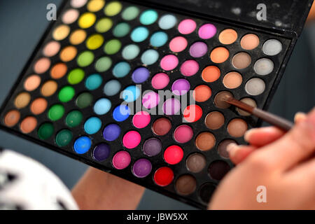 Hanover, Germany, make-up artist with a colorful color palette Stock Photo