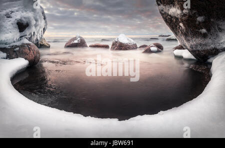 Scenic landscape with sea and lovely morning light at winter time Stock Photo