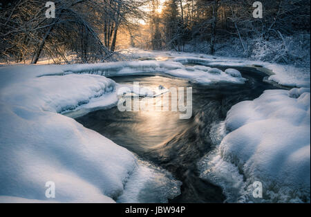 Scenic landscape with flowing river at winter morning Stock Photo