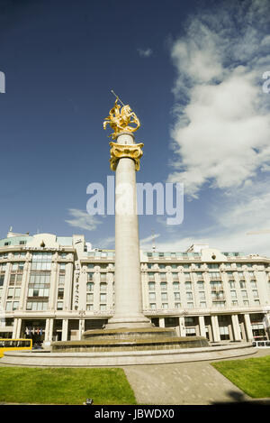 Gilded statue of St George slaying the dragon in the Freedom Square in Tbilisi, Georgia Stock Photo