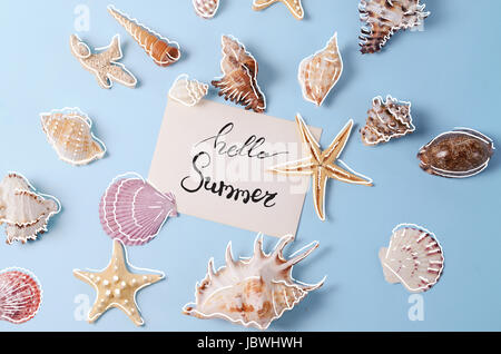 Creative layout made of different colorful seashells and greeting card Stock Photo