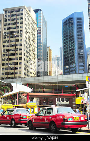 HONG KONG - MAY 22, 2012: Taxi on the street in Hong Kong. Over 90% daily travelers use public transport. Its the highest rank in the world. Stock Photo