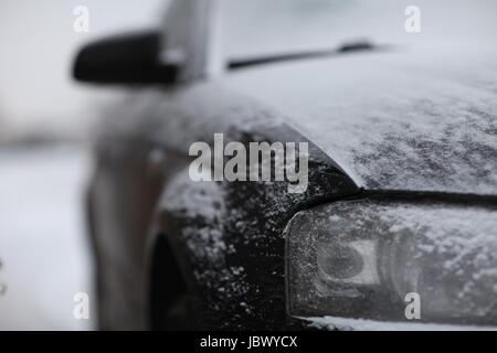 fragment of the car, front view, snow ice Stock Photo