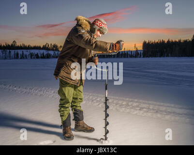 Ice Fishing, Kangos, Lapland, Sweden Stock Photo