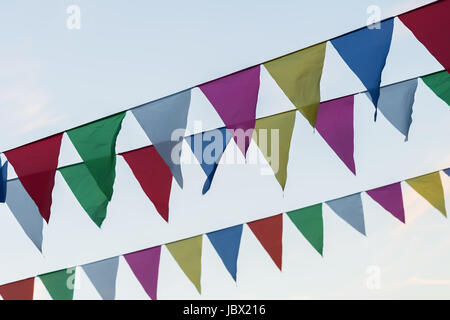 Banner formed of colourful triangular flags hanging on string Stock ...