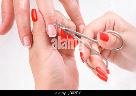 Cuticles cutting with scissors Stock Photo