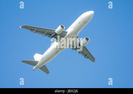 Passanger plane flying. Airliner in the sky Stock Photo - Alamy