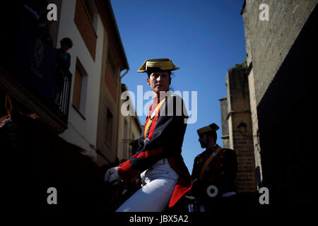 A female civil guard or guardia civil rides a horse during Easter Week celebrations in Baeza, Jaen Province, Andalusia, Spain Stock Photo