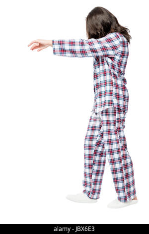 young sleepwalking woman in pajamas isolated on white background Stock ...