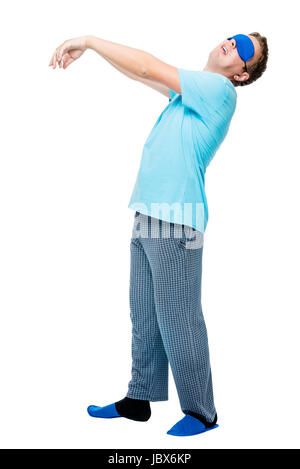 Man suffers from sleepwalking, portrait in pajamas on white background Stock Photo