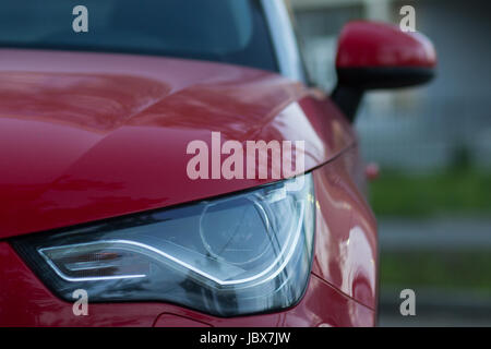 The red compact car light with LED backlight in the evening Stock Photo