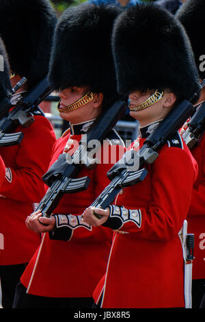 Irish Guards march down the mall towards Horse Guards Parade for the Duke of Cambridge to take The Colonel's Review at The Mall / Buckingham Palace, London , UK  - Saturday June 10, 2017. The Colonel's Review is the second rehearsal for the Trooping the Colour parade which takes place on the 17th June. Stock Photo