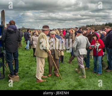 two gentleman talking in large crowd at point to point race meet ...