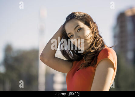 Summer sunny lifestyle fashion portrait of young woman posing in the city Stock Photo