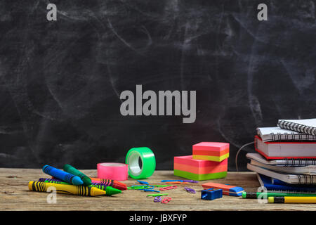 Education concept - School supplies on a wooden desk Stock Photo